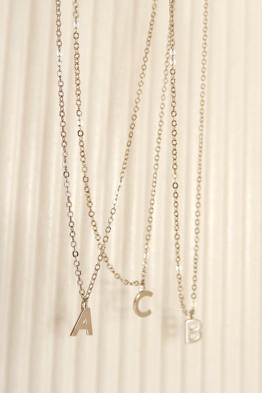 Silver letter charms